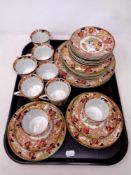 A tray of thirty pieces of 19th century tea china in Oriental style