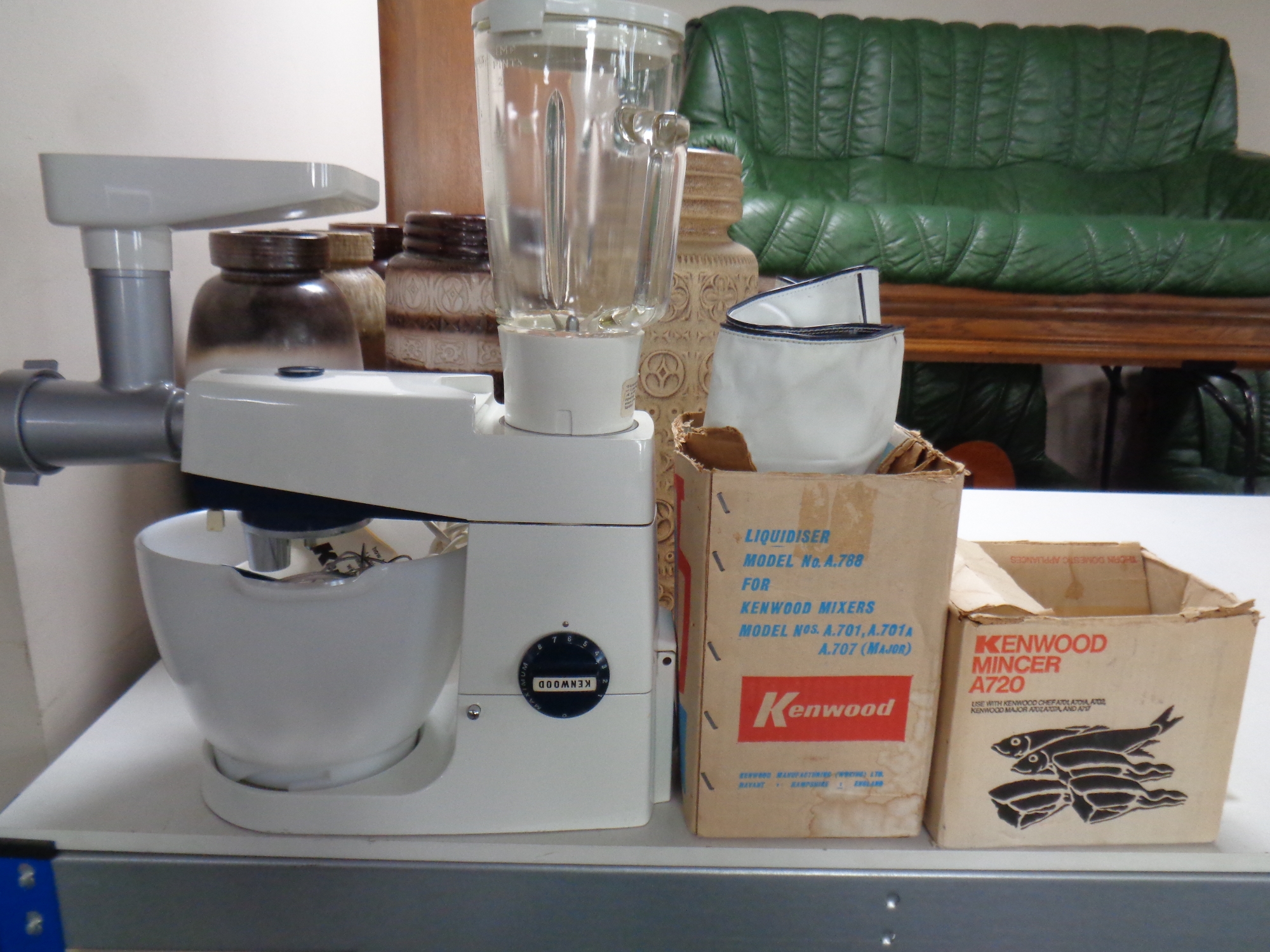 A vintage Kenwood food mixer with accessories