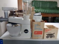 A vintage Kenwood food mixer with accessories