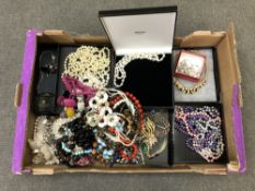 A box of costume jewellery, bead necklaces,