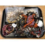 A tray of costume jewellery, bangles, simulated pearls,