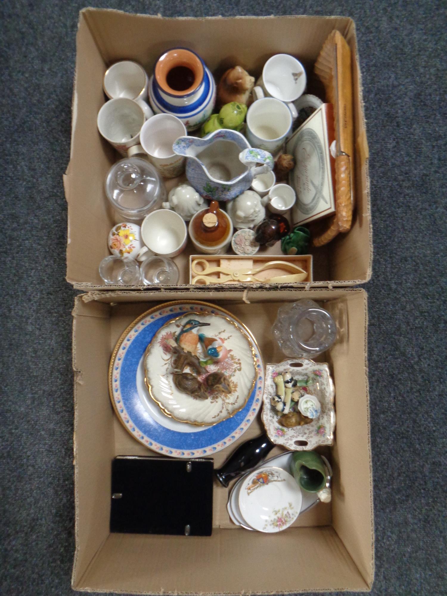 Two boxes of ceramics and glassware, Poole pottery mice, commemorative mugs, wooden chopping board,