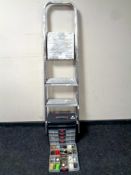 A set of aluminium folding steps together with a plastic six drawer chest containing fixtures,