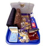 A tray of lady's hand bags, costume jewellery, 9ct gold watch case.