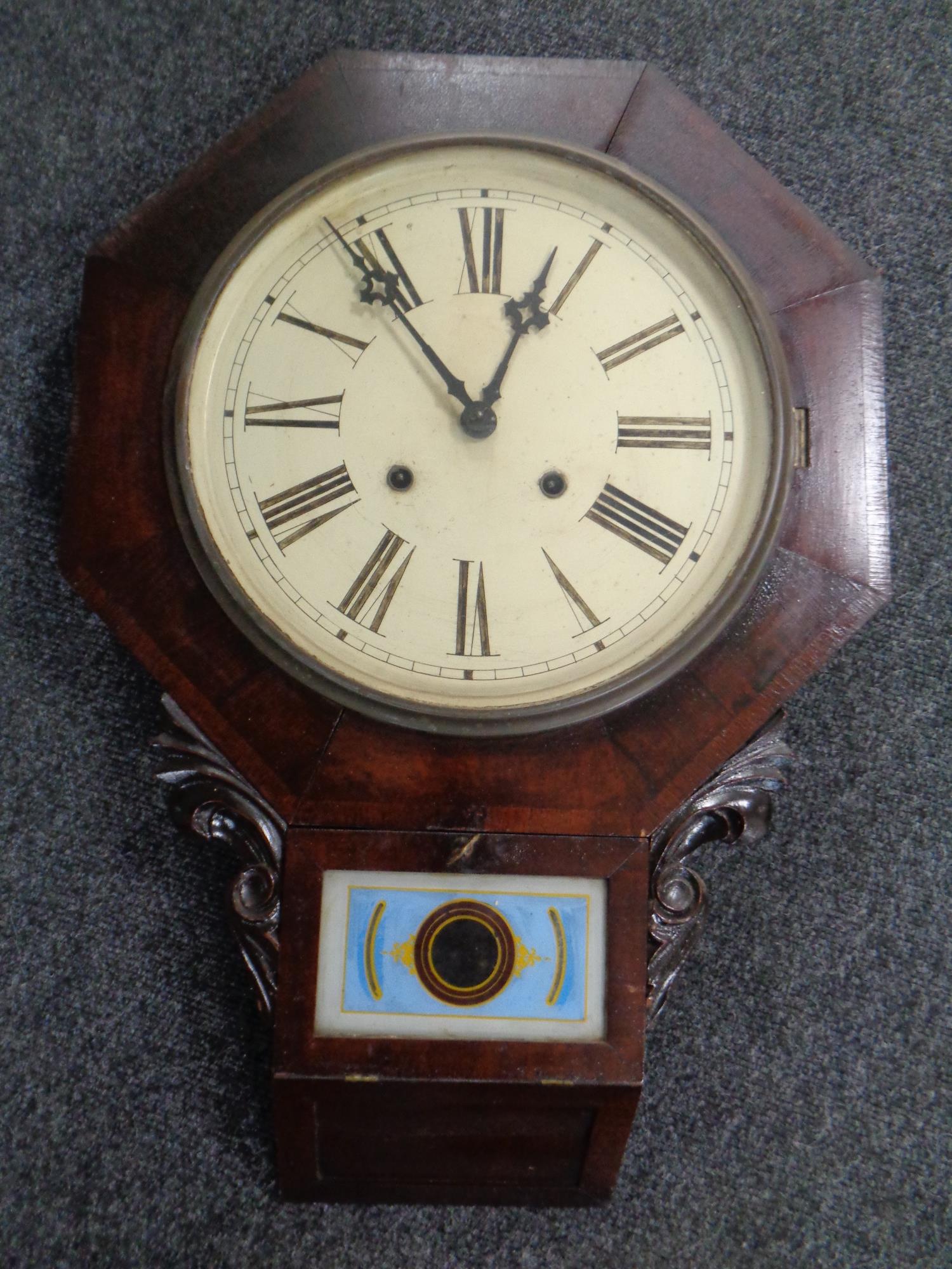 A 19th century American wall clock by the Waterbury Clock Company
