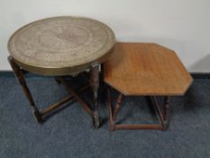 An Edwardian carved occasional table together with an Eastern brass topped table