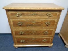 A 19th century mahogany four drawer chest on bun feet