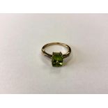 A 9ct gold peridot dress ring, size P CONDITION REPORT: 2.