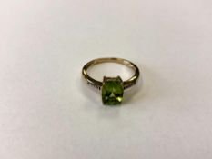 A 9ct gold peridot dress ring, size P CONDITION REPORT: 2.