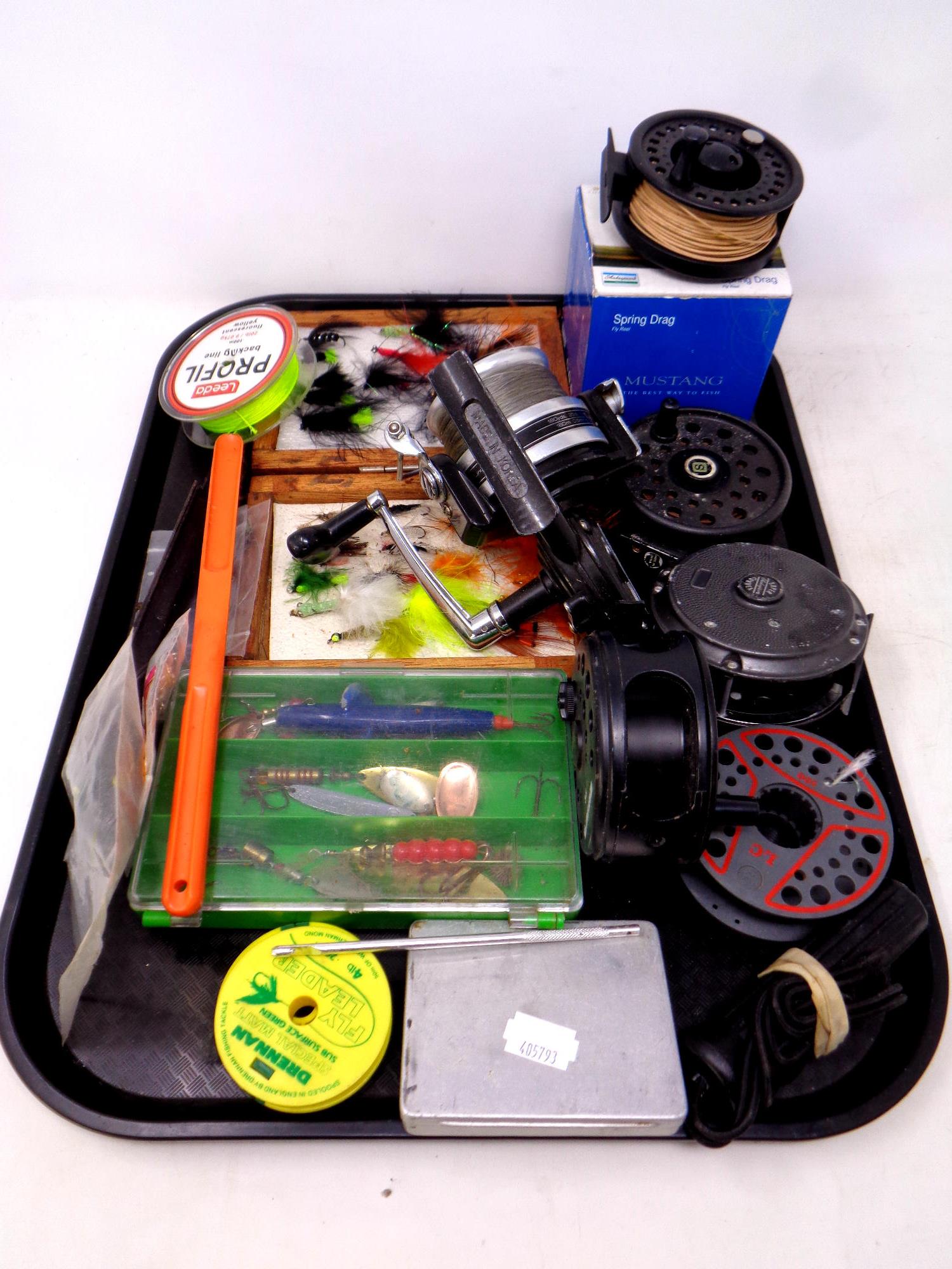 A tray of fishing equipment to include Kassnar fishing reel, Shakespeare reels, lures, flies, line,