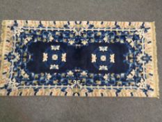 A Chinese rug on blue ground,