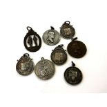 A collection of eight shooting medals, six in silver,
