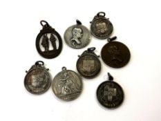 A collection of eight shooting medals, six in silver,