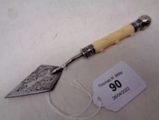 A Victorian silver plated butter knife in the form of a miniature trowel, length 16.5 cm.