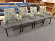 A set of four Designer's Guild Furniture armchairs upholstered in a two-tone fabric