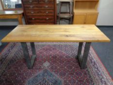 An oak topped refectory dining table on metal industrial style legs