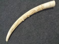A carved resin tusk