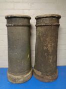 A pair of antique chimney pots