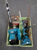 Two wooden crates containing Black and Decker chainsaw with chain oil, drill stand,