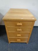 A 20th century oak four drawer office chest