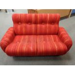 A mid century Danish two seater settee in red striped fabric