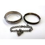 Two silver bangles and an antique Albert bracelet