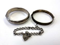 Two silver bangles and an antique Albert bracelet