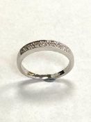 An 18ct white gold diamond half eternity ring, approximately 0.