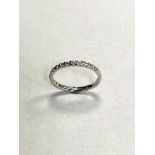 A 9ct white gold diamond half eternity ring, approximately 0.25ct.