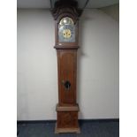 A 19th century oak longcase clock with brass and silvered dial signed H Smith of Mareboe,