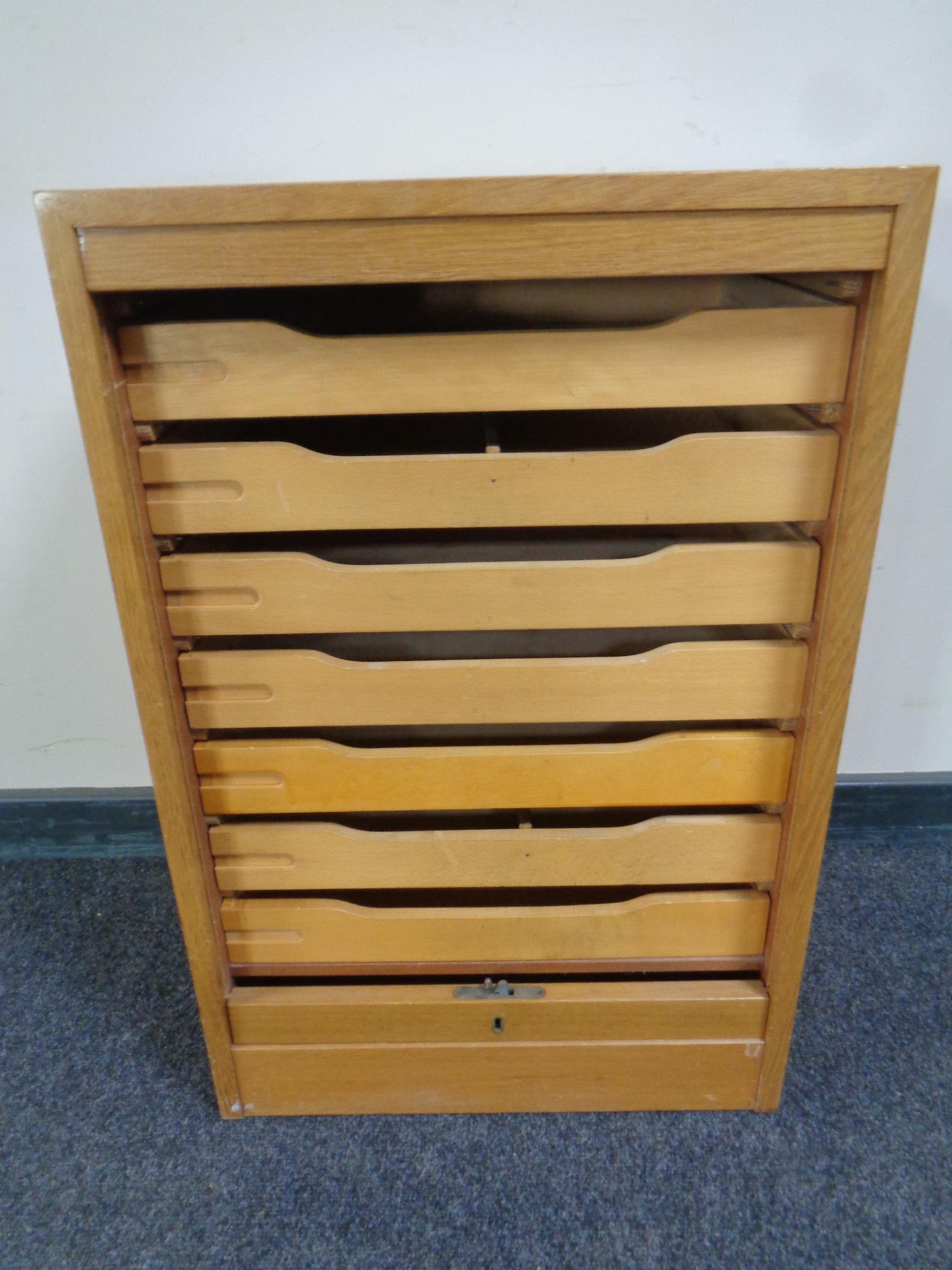 A 20th century shutter fronted music cabinet