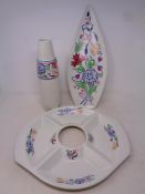 A Poole pottery vase together with a shaped dish and chip 'n dip plate