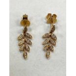 A pair of 18ct yellow gold diamond leaf earrings