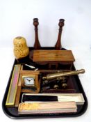 A tray containing oak musical jewellery box, Edwardian candlesticks, Russian dolls, hand fans,