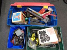 Three plastic crates containing a quantity of assorted power tools, hand tools,