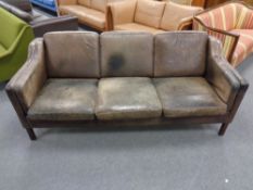A Danish 20th century three seater settee in brown leather