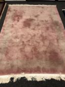 A Chinese rug on pink ground,