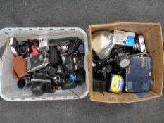 A box and crate containing cameras, accessories,