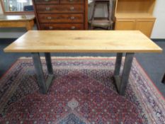 An oak topped refectory dining table on metal industrial style legs