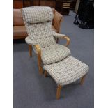 A Swedish Broderna Anderssons armchair and footstool in beige fabric