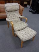 A Swedish Broderna Anderssons armchair and footstool in beige fabric
