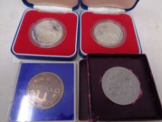 Two boxed Elizabeth II silver proof crowns together with a Festival of Britain 1951 coin and Apollo