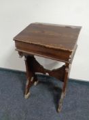 A stained pine school desk