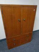 A 20th century oak linen cabinet fitted with two drawers