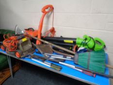 A large quantity of garden tools including Visimo electric lawn mower, Flymo multi trim,