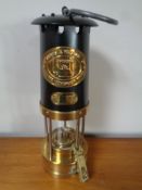 A Thomas and Williams brass and metal miners lamp