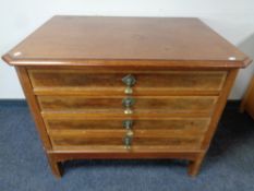 A 19th century mahogany four drawer chest on raised legs