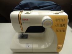 A Toyota STF 92 electric sewing machine in carry bag with lead and pedal