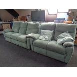 A G-Plan three seater settee and two seater settee upholstered in green fabric