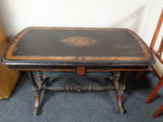 A Victorian ebonised inlaid library table